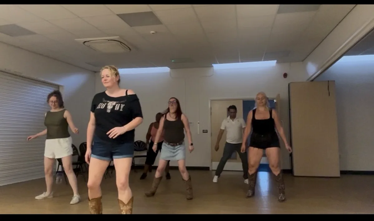 A Boot Scootin' line dancing class practising together